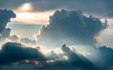 Dramatic sky, light from heaven. Sun and clouds. Background